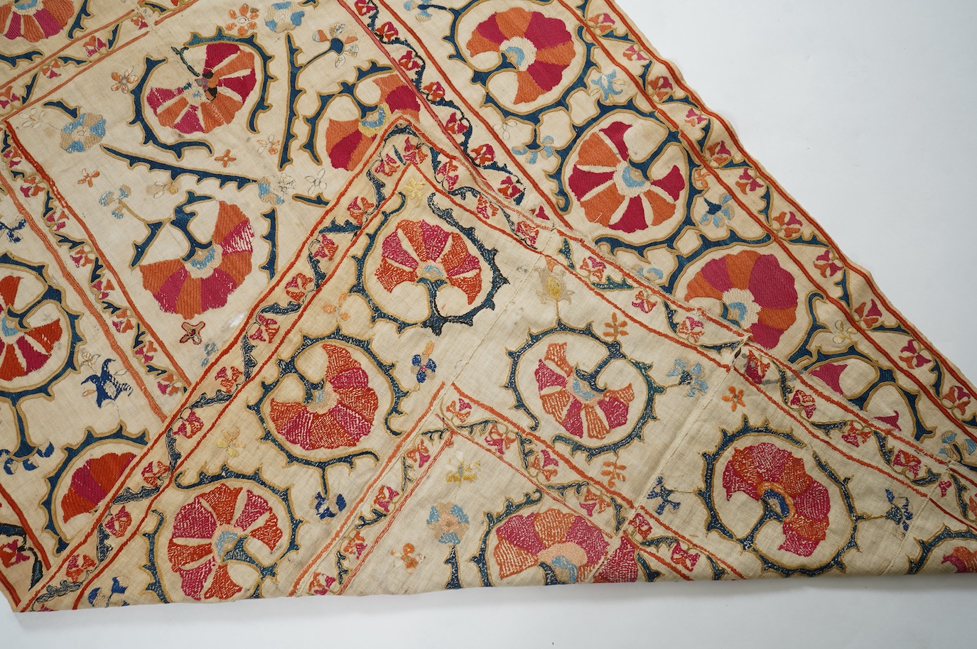 A 19th century Uzbekistan Suzani, hand embroidered hanging. Made from hand woven linen panels each approximately 28cm wide x 167cm long. Hand embroidered with silk hand dyed threads, in orange, red, blue and yellows, usi